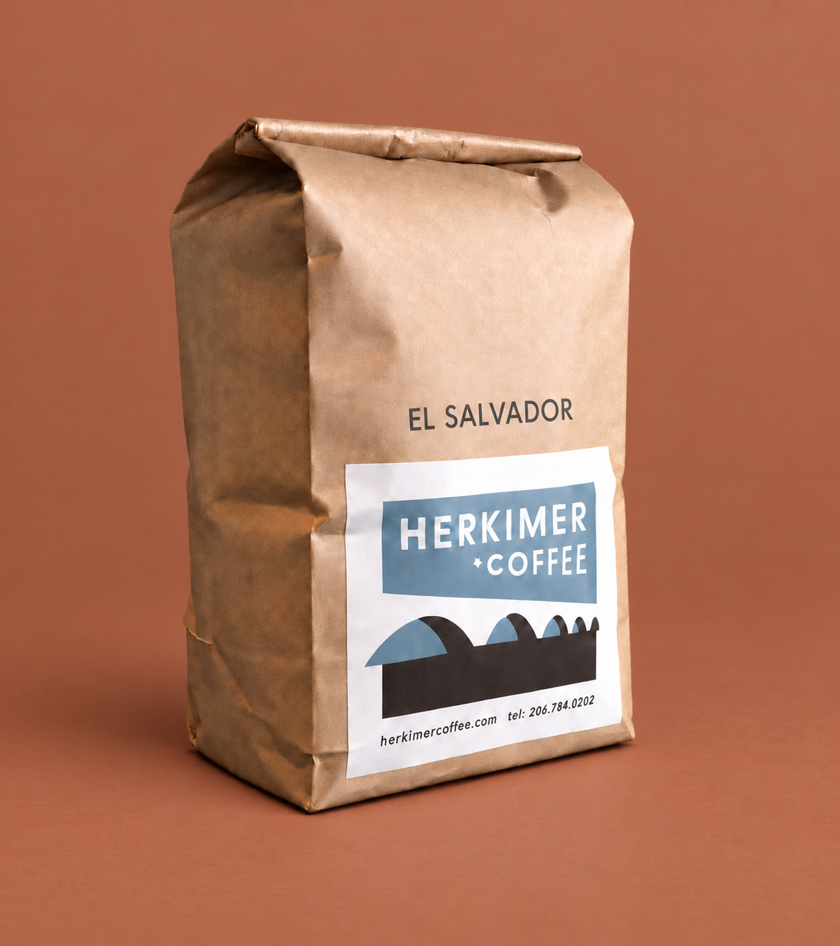 El Salvador whole bean coffee by Herkimer Coffee on a colored studio background
