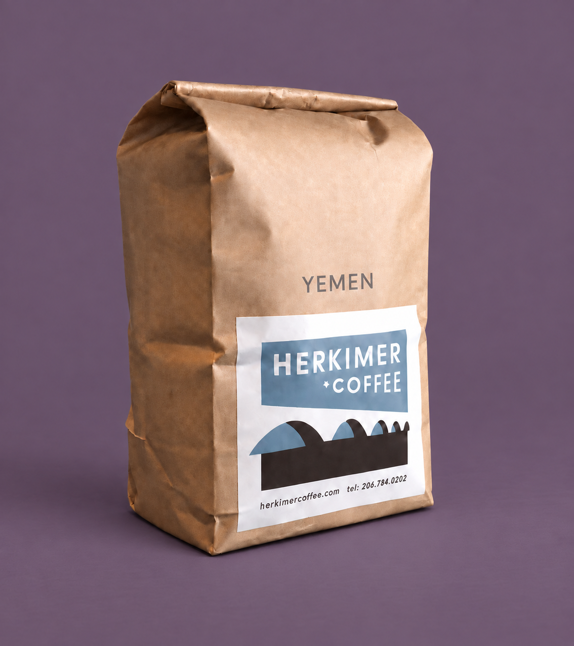 Yemen whole bean coffee by Herkimer Coffee on a colored studio background